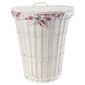 White wicker laundry basket with floral lining