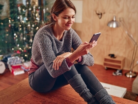 Young adult scrolling through their new phone