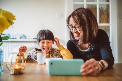 Mother and daughter laughing