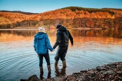 Couple walking in a lake.
