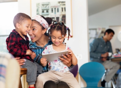 mum with children on tablet 